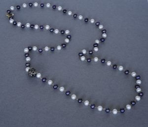 Blue and white pearls with black diamonds