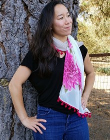 Woman wearing Pink Flowers on Off White, Fuchsia Pom Poms