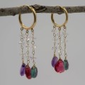 Droplet earrings hanging on display